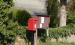 Communications in the countryside: a small post box and a village notice board